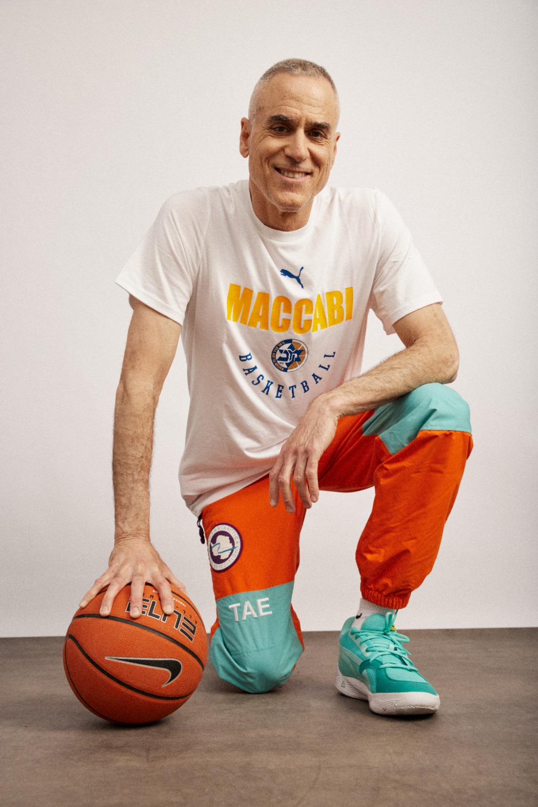 Lay Z Gordon with a Maccabi basketball